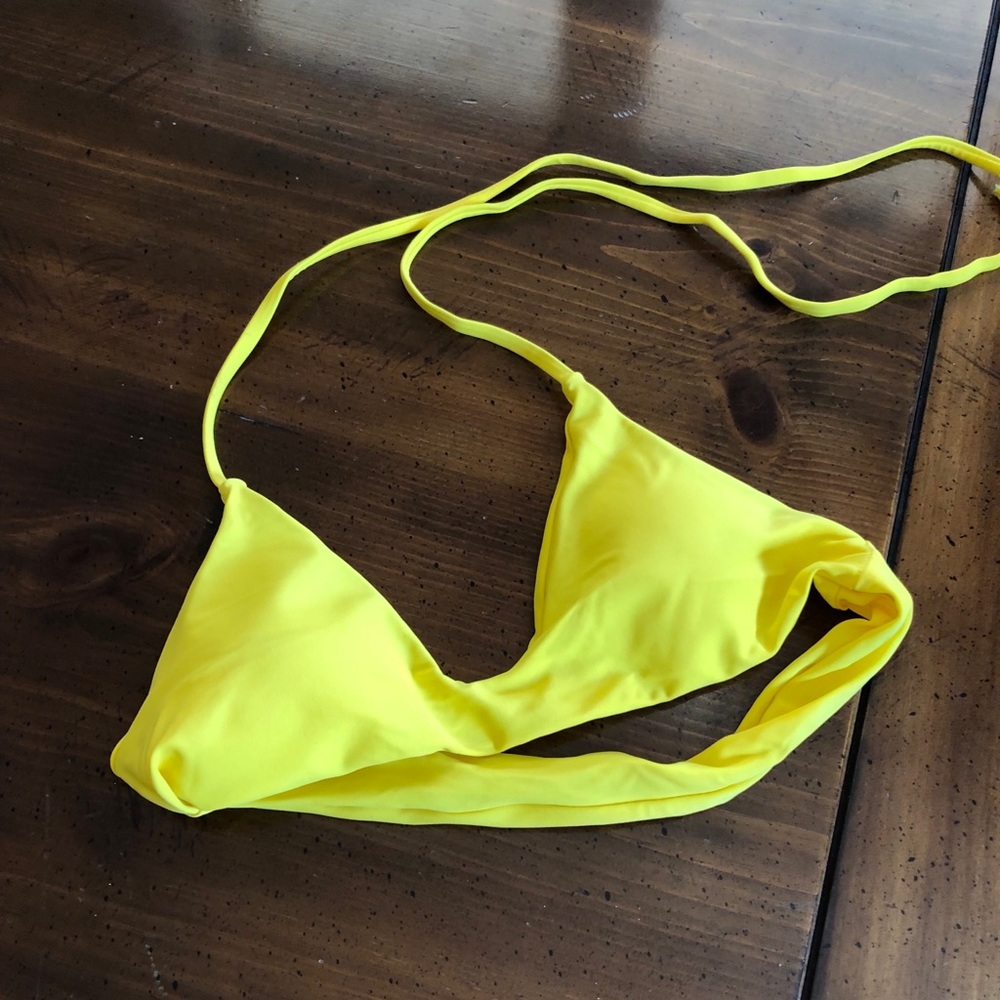 Bright yellow swimsuit top